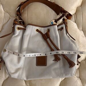 Dooney & Bourke White and Brown Leather Drawstring Shoulder Bag with Tassels